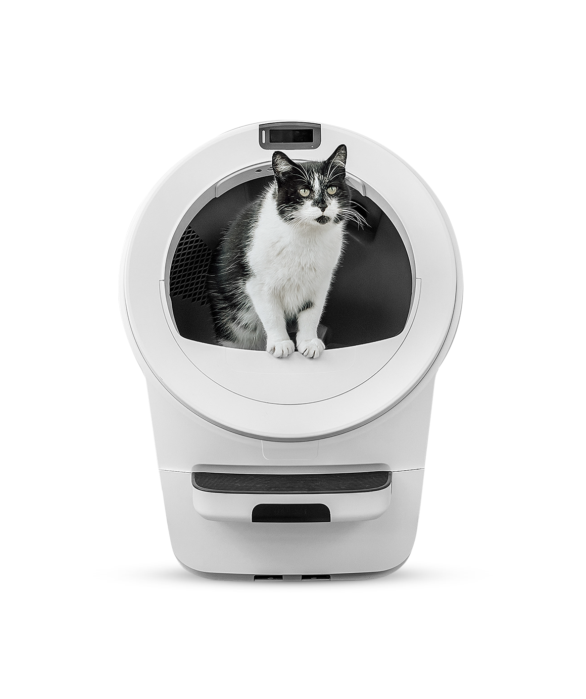 A black and white cat sitting inside a white Litter-Robot 5